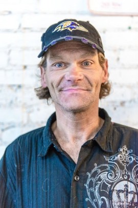 Michael Poor, 47, visits the needle exchange at the Center for Harm Reduction, which is part of Homeless Healthcare Los Angeles, on a daily basis. He lives in a tent on Skid Row and is addicted to methamphetamine. (Heidi de Marco/KHN)