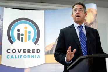 FILE - In this Nov. 13, 2013 file photo, Peter Lee, executive director of Covered California, the state's health insurance exchange, talks at a news conference in Sacramento, Calif. Long before it opened its doors to the public last fall, California's health insurance exchange awarded a small contract to a business consultant, Leesa Tori, for her advice on designing a program to sell insurance to small companies The industry veteran was a friend and former co-worker of Peter Lee, the exchange's top executive. The seemingly minor deal would mark the beginning of a lucrative and far-reaching partnership between the new state agency and the boutique consulting company Tori formed last year, just as national health care reform took root across the U.S. (AP Photo/Rich Pedroncelli, File)