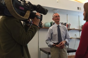 Daren Wintemute, director of the UC Davis Medical Center's Violence Prevention Research Program, talks about gun control with health care reporter Vicki Gonzalez, left, and a cameraman, both of KCRA 3 television news in Sacramento. (Cynthia H. Craft for KHN)