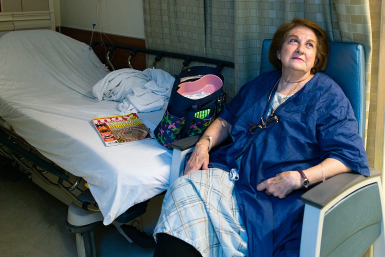 After being seen in the emergency room, Castellanos waits for a hospital bed for further testing. (Heidi de Marco/KHN)
