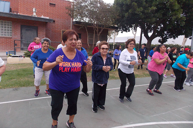 Some of the participants in 3 WINS Fitness have diabetes, high blood pressure or other chronic diseases. The free program, run by Cal State Northridge kinesiology students, gives people a way to exercise without having to pay for expensive gym memberships. (Anna Gorman/KHN)