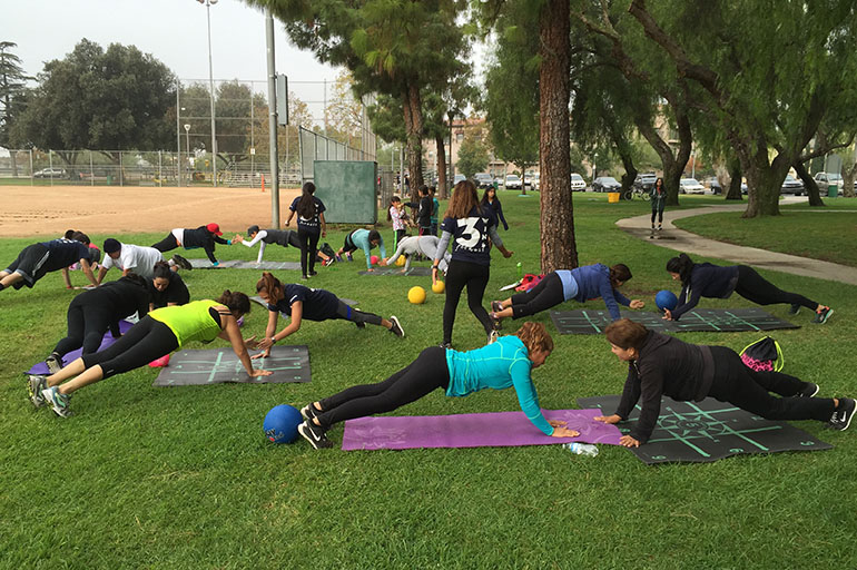 Recreation Park in San Fernando was often empty before Cal State Northridge students began offering free exercise classes. Now, the park is packed on the mornings the students are there. The students can get academic credit for their work with 3 WINS Fitness. (Anna Gorman/KHN)