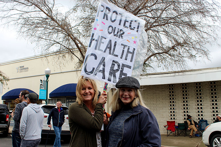 Veronica Blake (left), 48, of Placer County, said she was interested in learning what Rep. McClintock had to say about the ACA replacement plan, but wasn’t able to get into event. Her mother passed away in 2013. When her mother divorced, she lost her husband’s employer coverage. It was difficult for an insurance to her take her because she had been diagnosed with breast cancer in her 30s, and although it had been cleared through a mastectomy, it was considered a preexisting condition. If her mother would have had insurance and better preventive care, her heart conditions could have been detected earlier and she might have lived longer, Blake said. (Ana B. Ibarra/California Healthline)