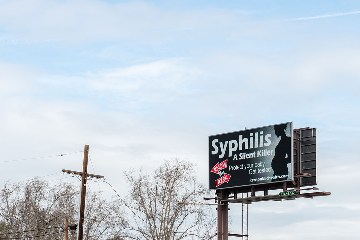 An electronic billboard near downtown Bakersfield, Calif., displays a public service announcement about sexually transmitted diseases on February 2, 2017. The Kern County public health department has embarked on a massive information campaign with the slogan, “Know Your Risk.” (Heidi de Marco/KHN)