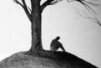 man sitting under tree