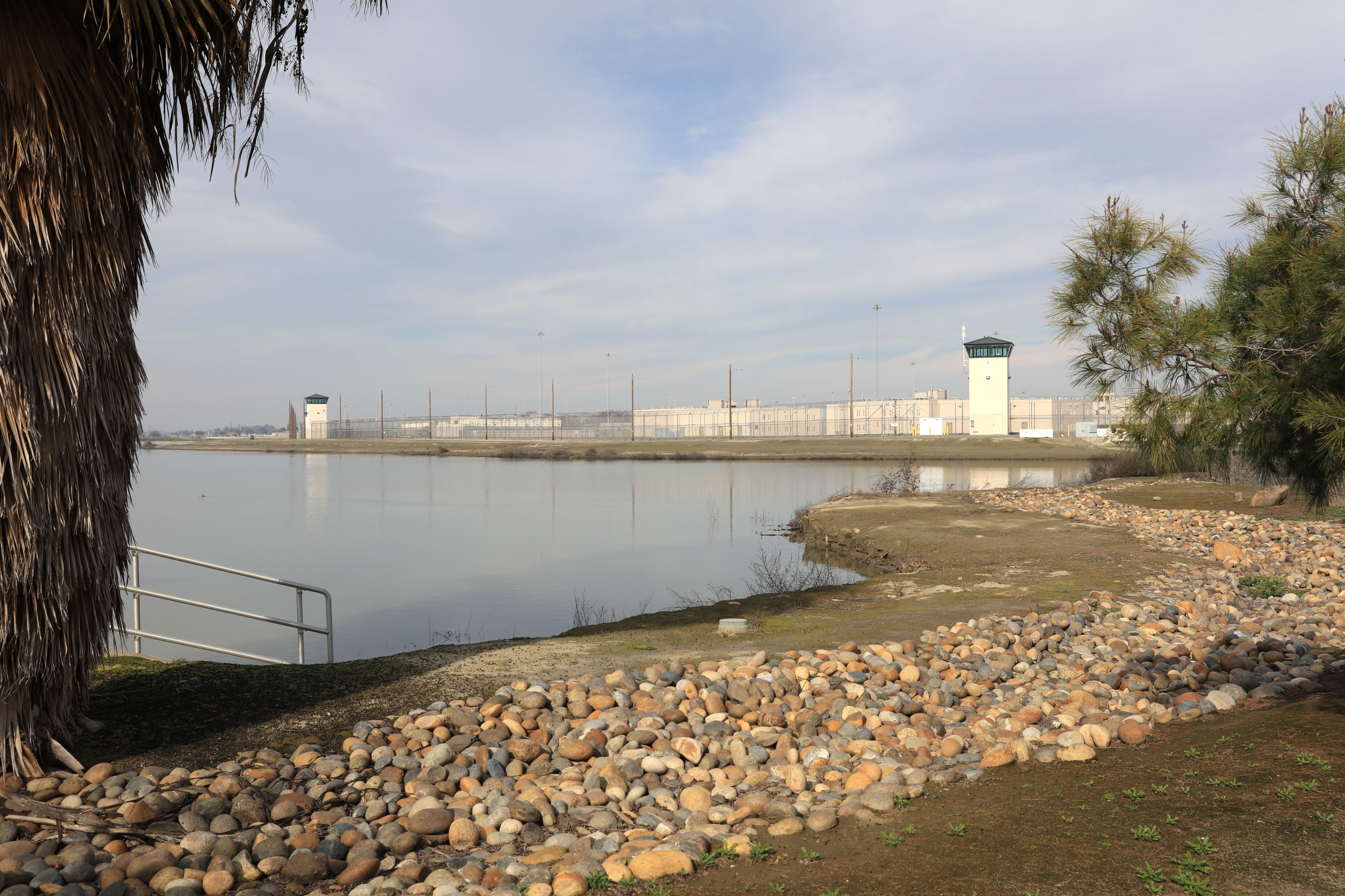 landscape of prison facility situated beside a lake