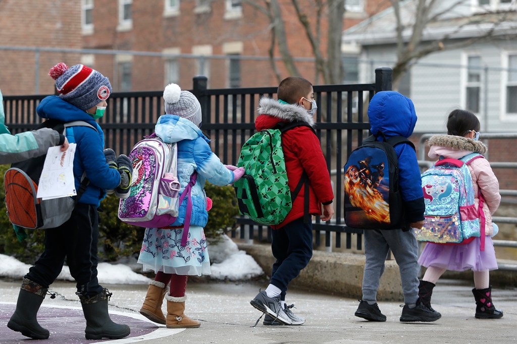 Elementary school students walk out of Saltonstall School in Salem, Massachusetts