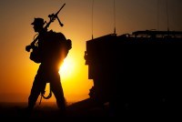 A machine gunner prepares to load an amphibious assault vehicle.