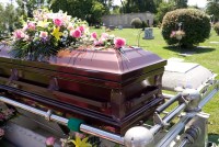 A coffin with flowers on it