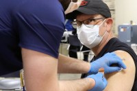 A man receives a COVID-19 vaccine