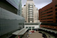 Cars are parked in front of the Massachusetts General Hospital entrance.