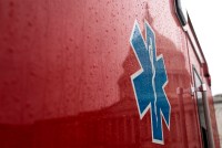 The reflection of the U.S. Capitol on the side of an ambulance is seen.