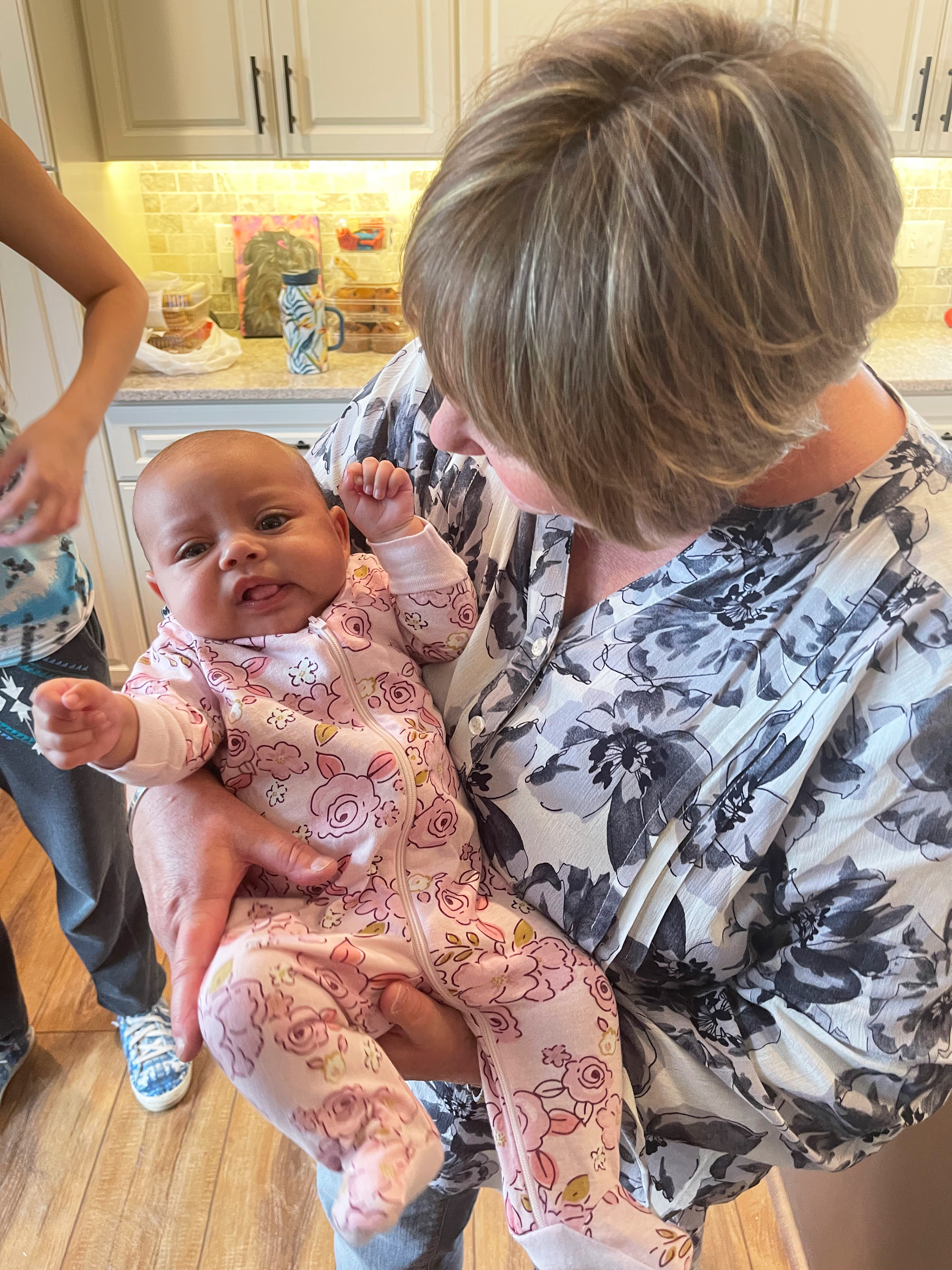 A photo shows Geralyn Laurie holding her granddaughter, Aubrey.