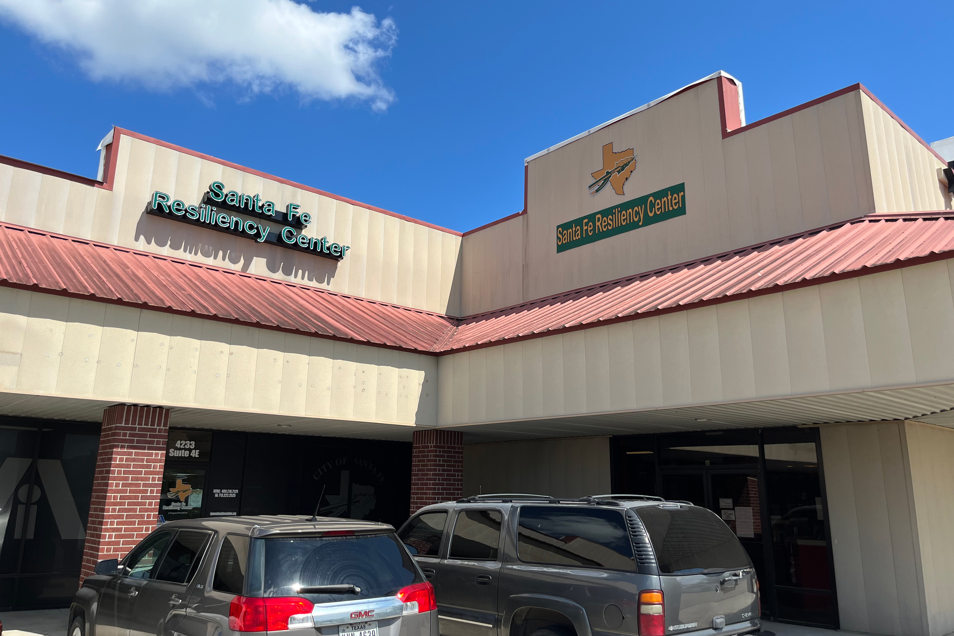 A photo shows the exterior of the Santa Fe Resiliency Center in a strip mall.