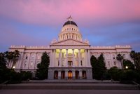 California's capitol building is seen at sunset.