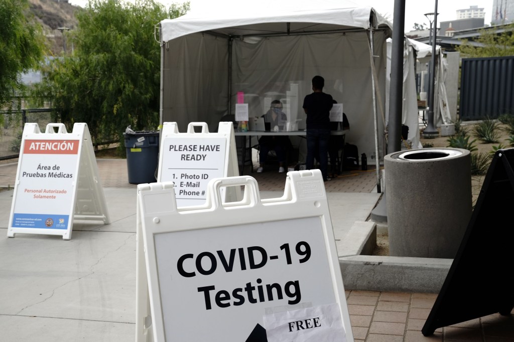 A Covid-19" sign at a coronavirus testing site at the San Ysidro port of entry in San Diego, California, U.S., on Tuesday, Aug. 25, 2020. California this week reported more signs of improvement in its outbreak, with 4,480 new cases, well below the 14-day average of 7,049. Photographer: Bing Guan/Bloomberg