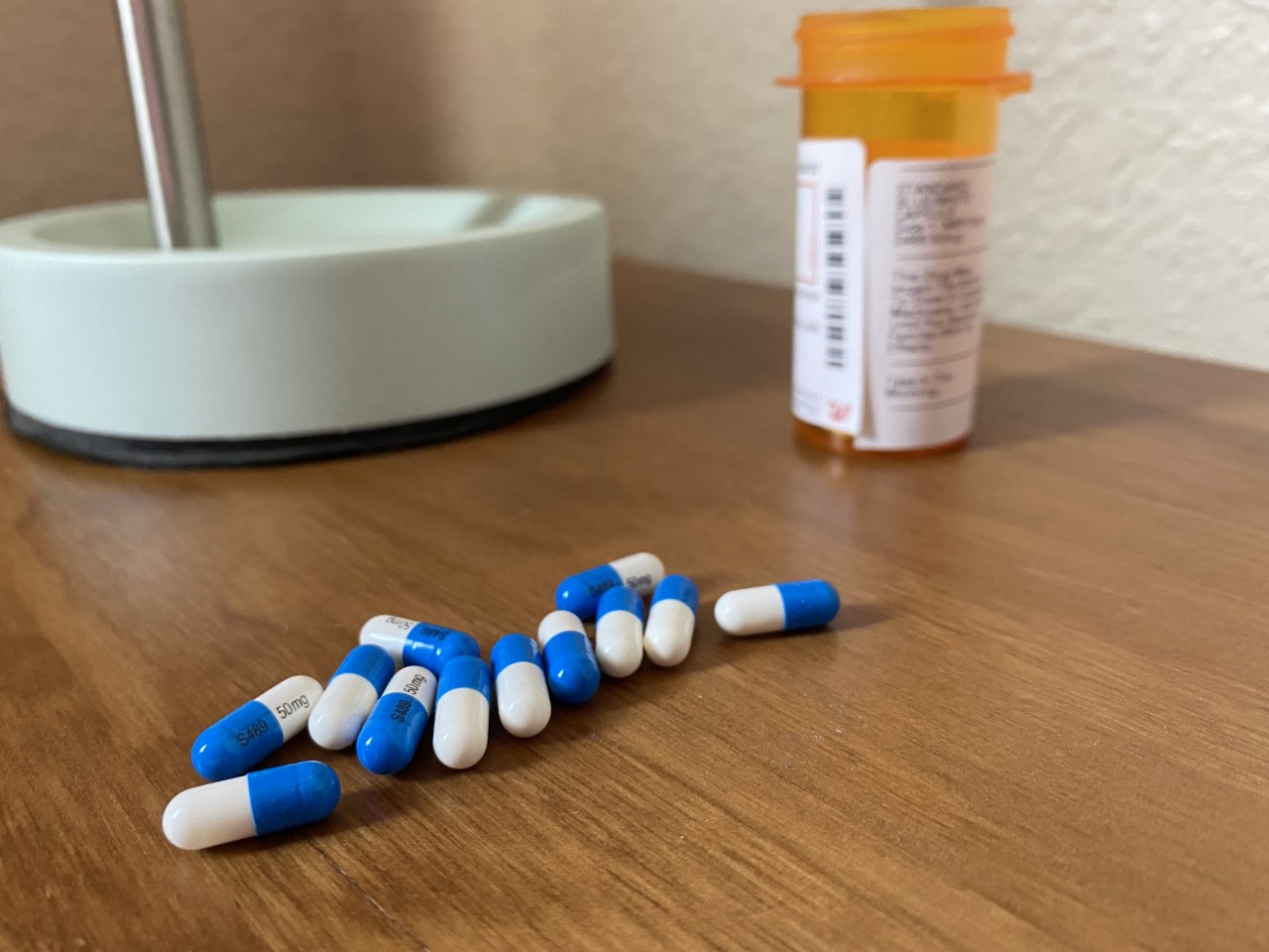 A photo of ADHD medication pills on a table.