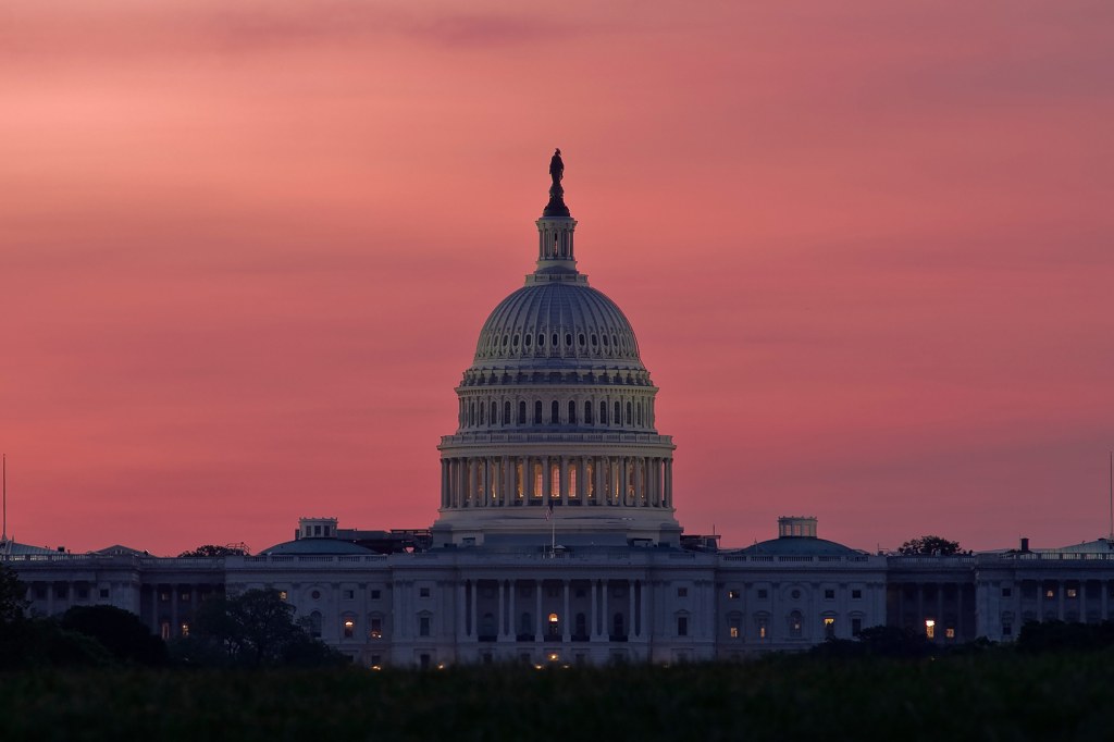 A photo of the dome of the U.S. Capitol at dawn.