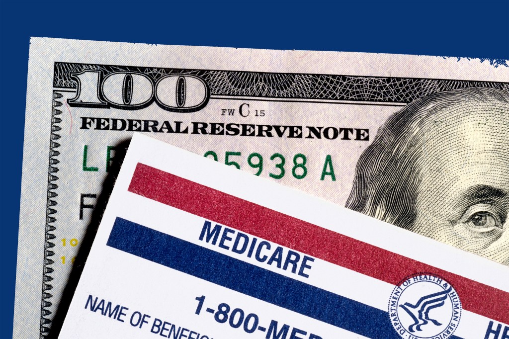 A medicare card is layered over a U.S. $100-dollar-bill.