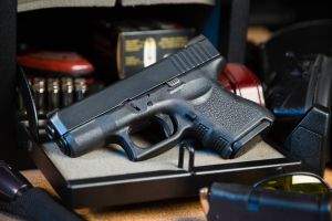 A photo of a pistol in a gun safe.