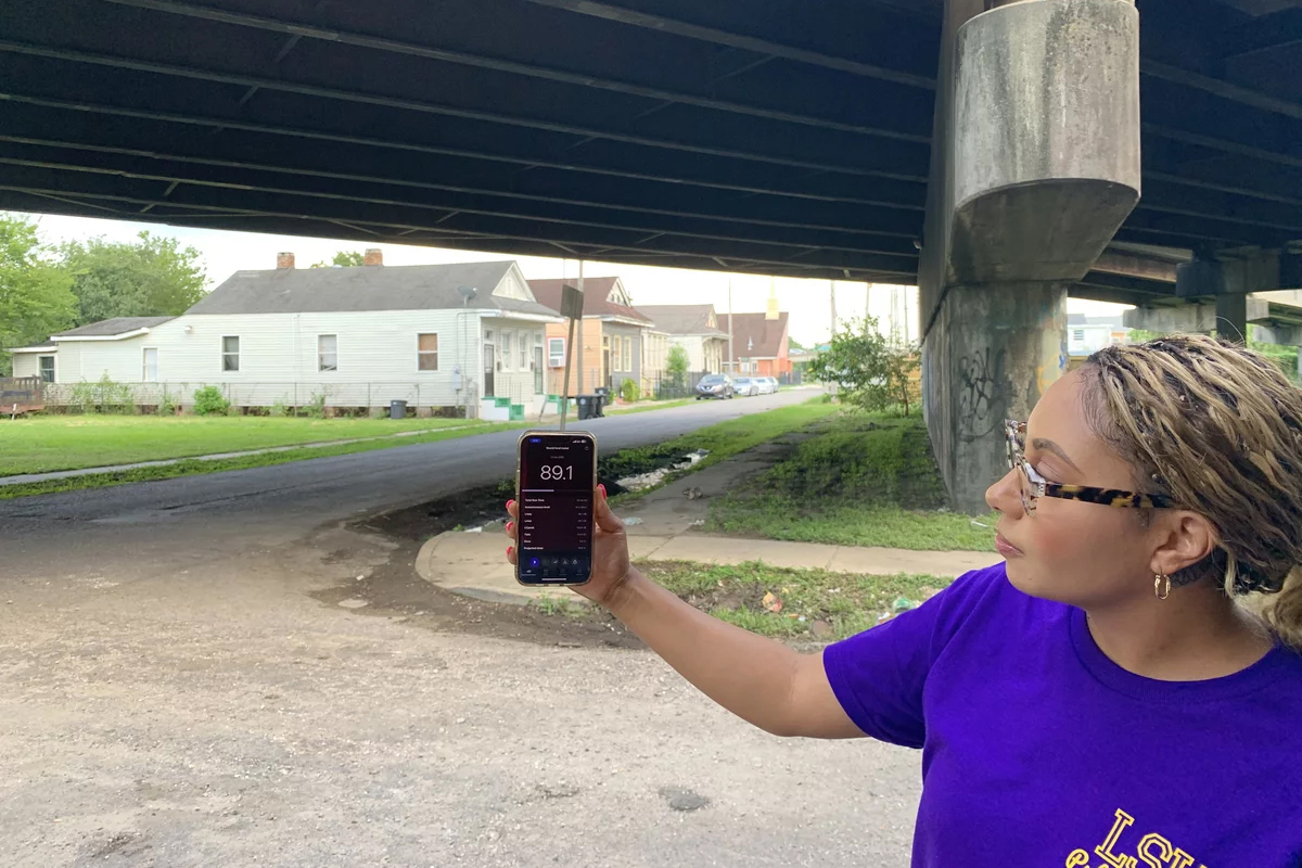 Graduate student researcher Jacquelynn Mornay shows a noise reading taken beneath the Claiborne Expressway on July 18, 2023, in New Orleans.