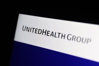 A photo of a laptop screen showing UnitedHealth Group's logo.