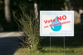 A sign with text that reads, "Vote NO on Fluoridation."