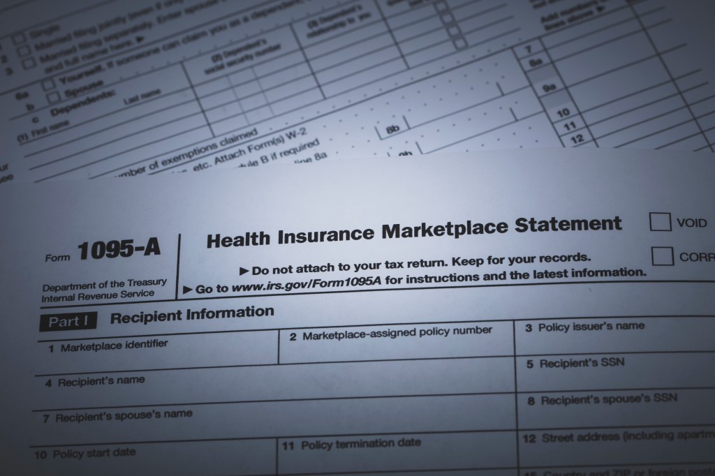 photo of IRS Form 1095-A used for reporting health insurance coverage on the IRS income tax report.