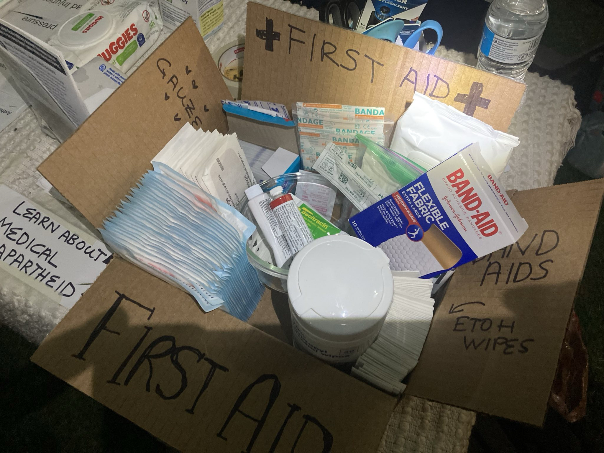 A photo of a cardboard box with first aid supplies.