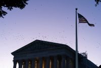 A photo of the Supreme Court's exterior at sunrise.