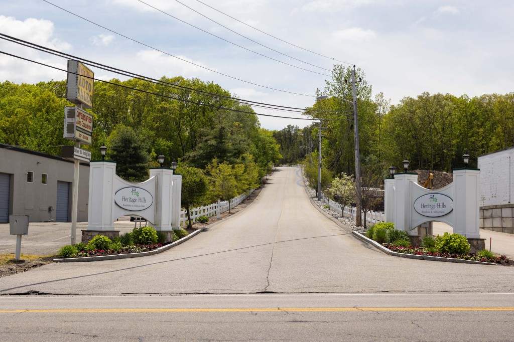 A long driveway at the entrance of Heritage Hills Rehabilitation & Healthcare Center in Smithfield, Rhode Island