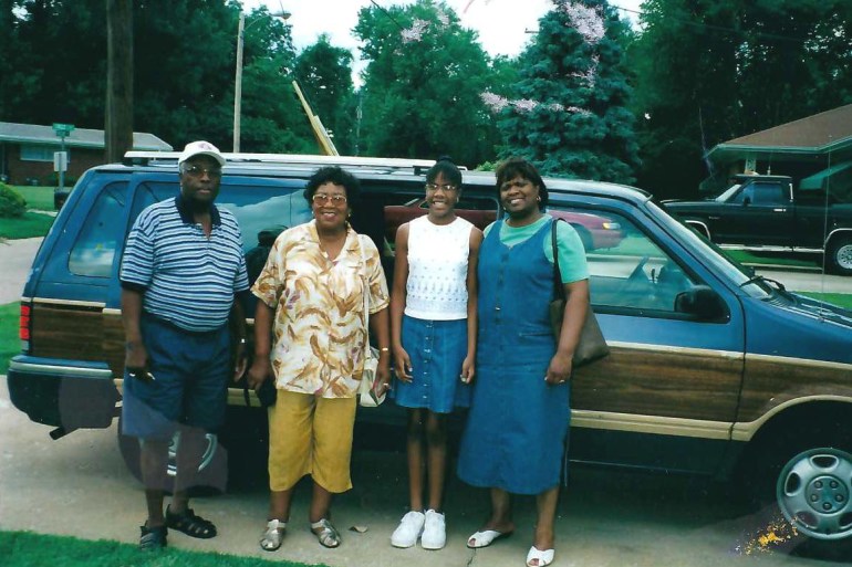 A 1946 color film photograph shows Wiliam Avery, Lorenzie Avery, Cara Anthony, and Cara’s mother standing in front of the family car.