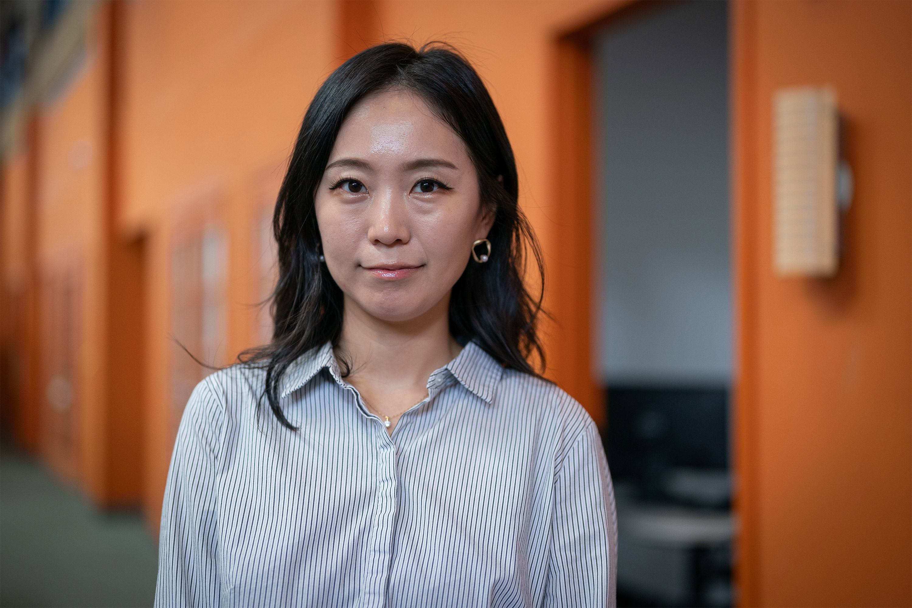 A photo of Jee Hyo Kim at the Asian Health Services office.