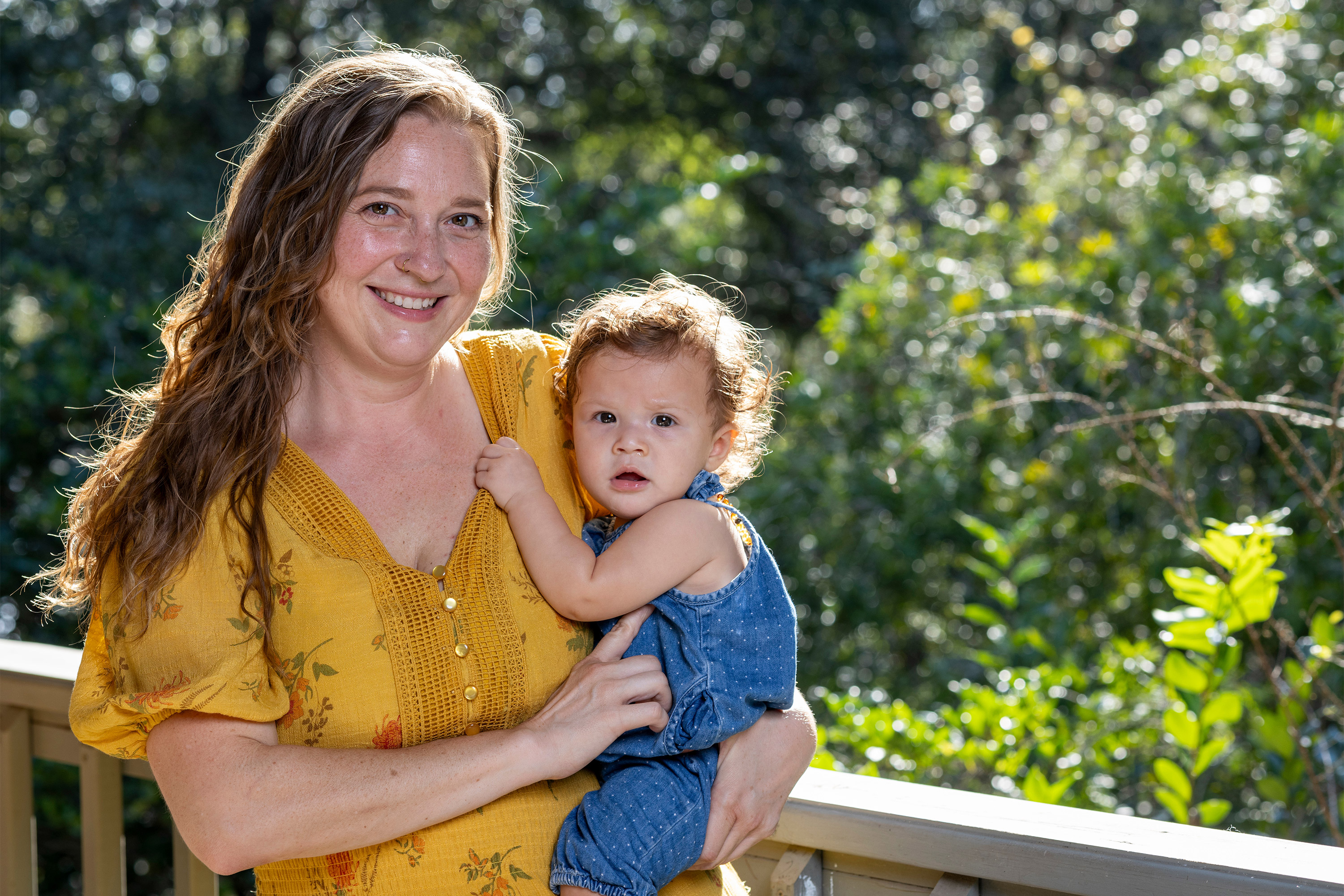 A photo of Rokx holding her baby.