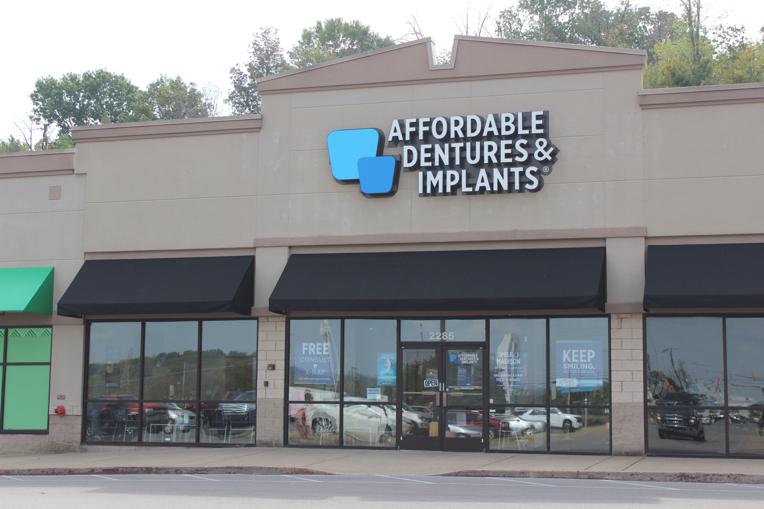 A photo of the outside of an Affordable Dentures & Implants clinic.