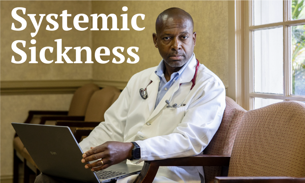 A portrait of a doctor sitting in a chair and looking towards the viewer.