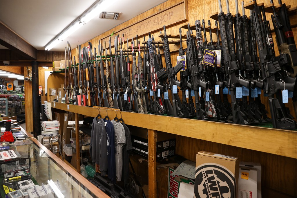 A photo of rifles for sale at a gun shop.