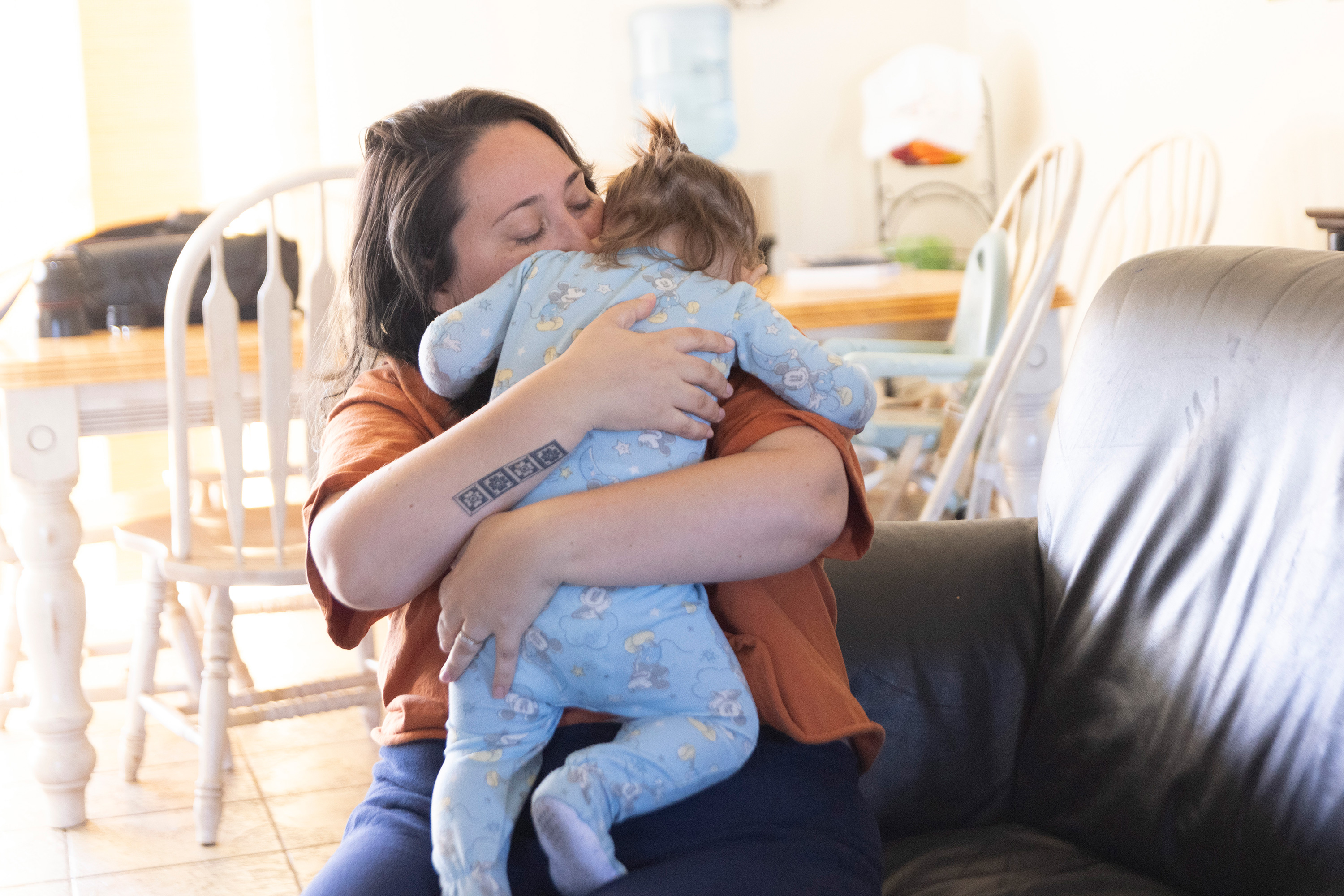 A photo of Sara England holding her son, Amari Vaca.