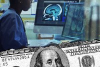 A photo illustration of a woman working at a computer in a medical setting. A hundred-dollar bill is layered on top.