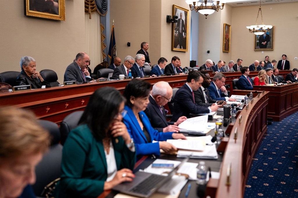 A photo of a members of the House of Representatives' Budget Committee seated in a hearing room.