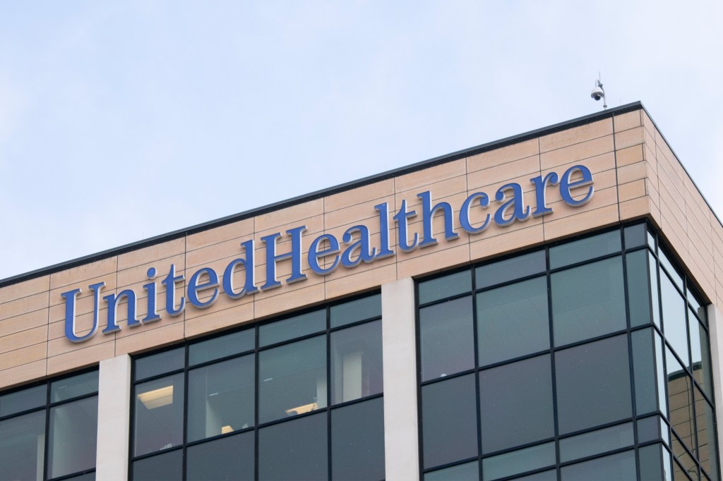 A photo of a large corporate building with the United Healthcare logo on it.