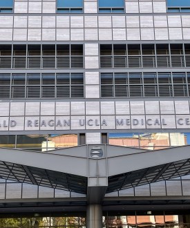 A building entrance with signage that says "Ronald Reagan UCLA Medical Center"